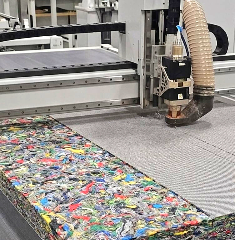 Cutting equipment working on a multicoloured fibre board
